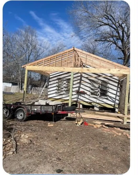 Tiny home framed on its trailer, walls sheathed