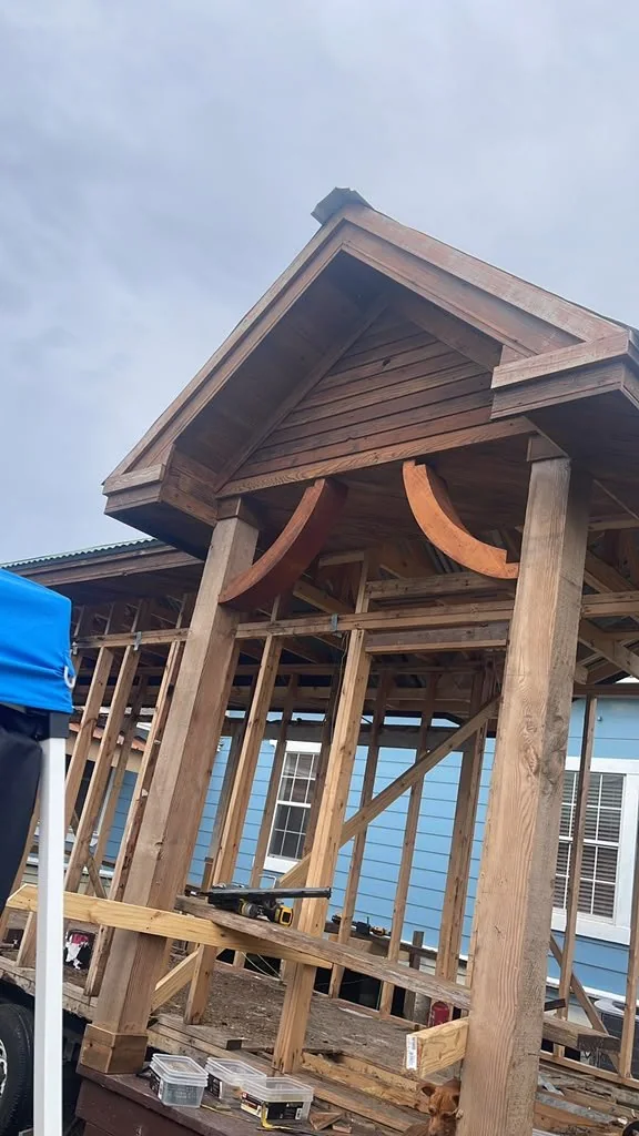 Timber porch structure with curved brackets