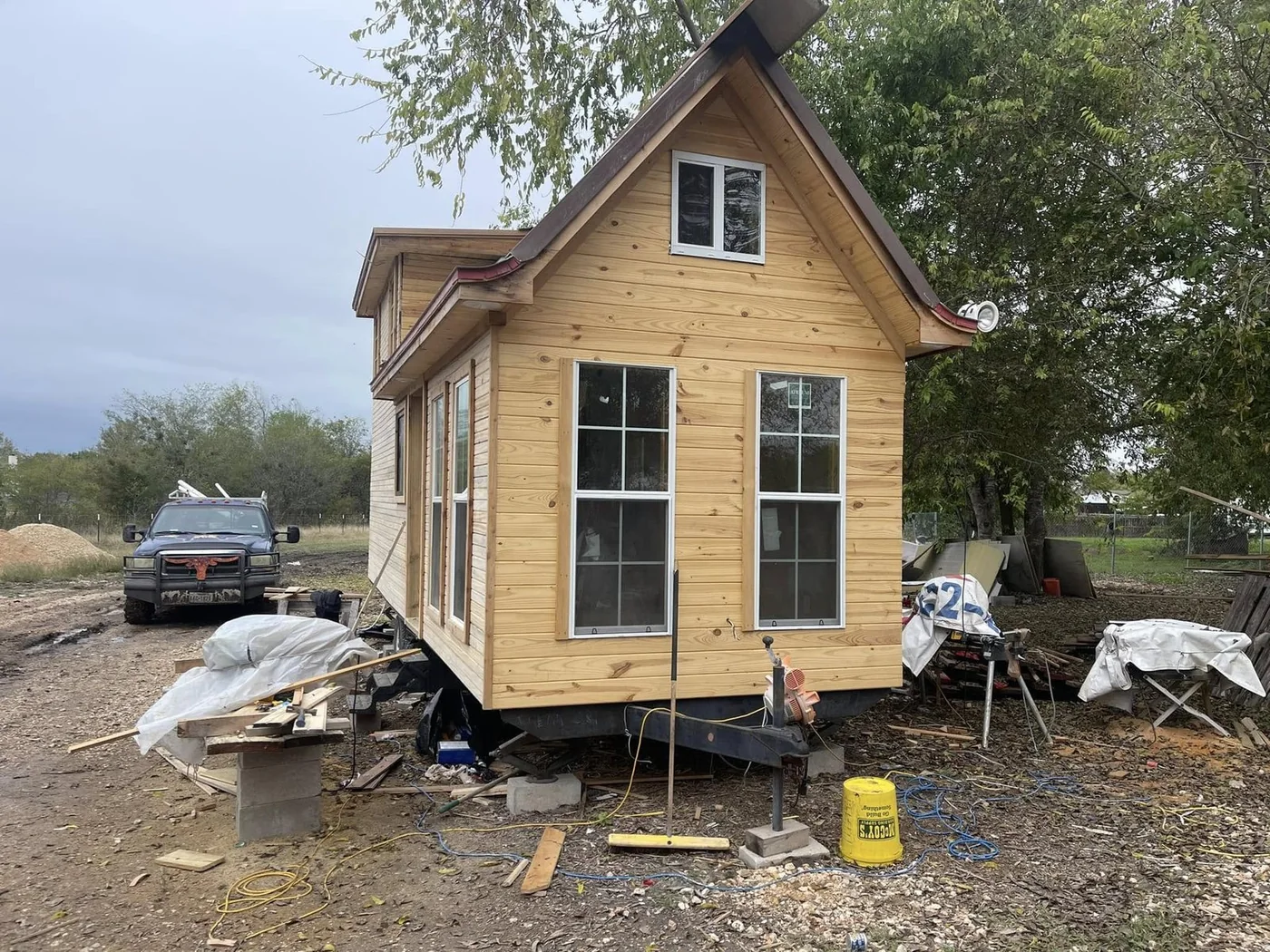 Cedar tiny home being set on its site